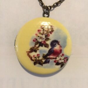 Songbird locket with bronze finish